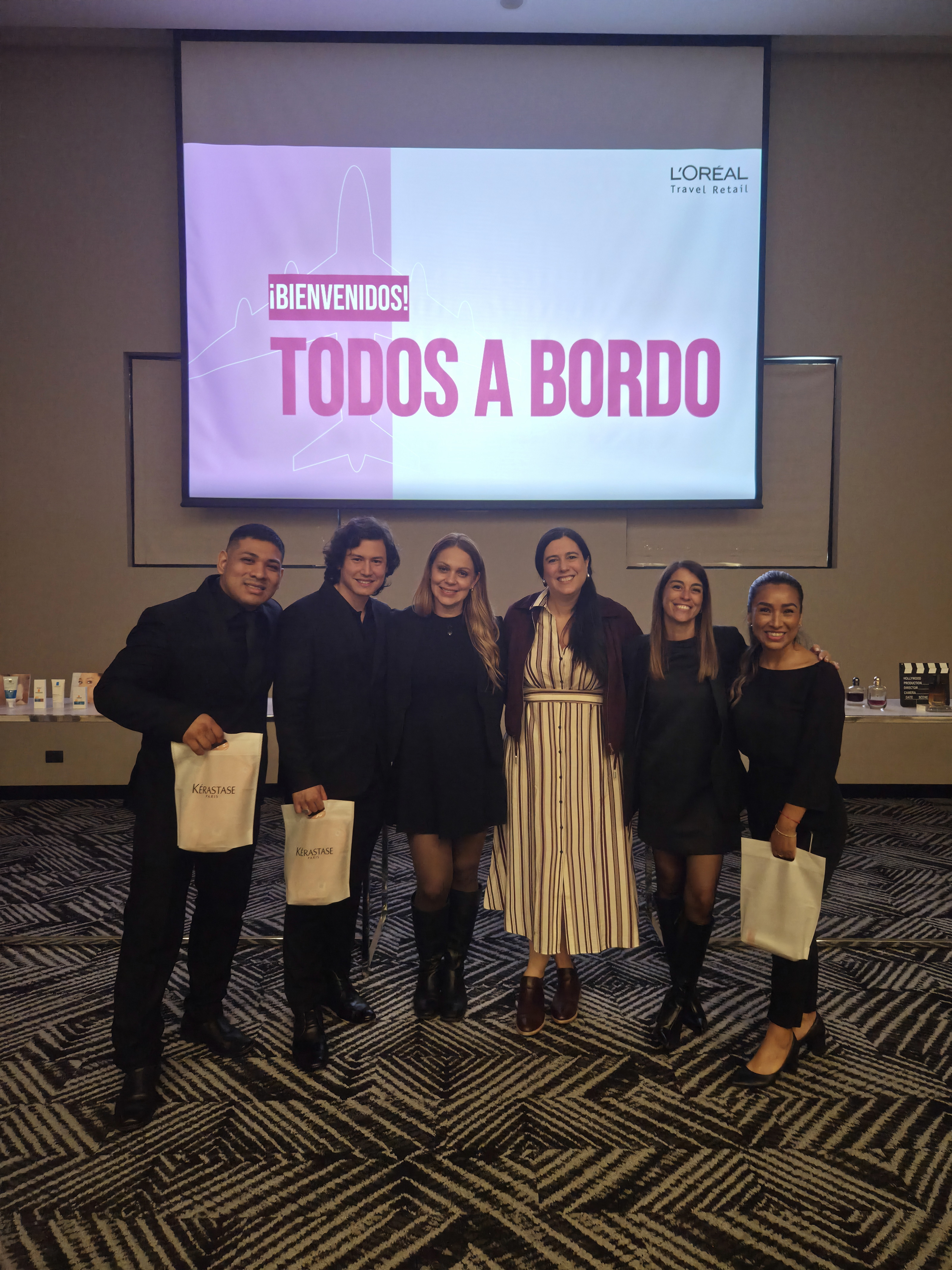 Three LanPeople Brand Ambassadors with two trainers and L’Oréal Travel Retail’s Area Manager