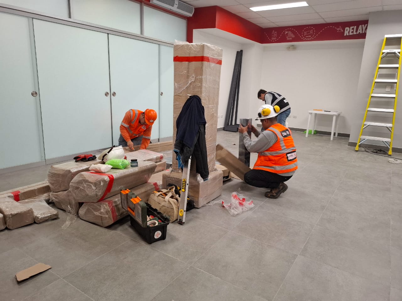 Technical team installing LanArq retail fixtures at a regional airport